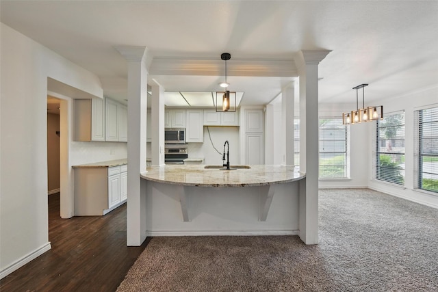 8104 Lea Shore St, Fort Worth, TX 76179 - kitchen with baseboards, white cabinets, light stone counters, a sink, and stainless steel appliances