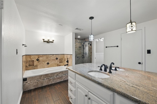 8104 Lea Shore St, Fort Worth, TX 76179 - full bath with a garden tub, visible vents, a shower stall, wood finished floors, and vanity