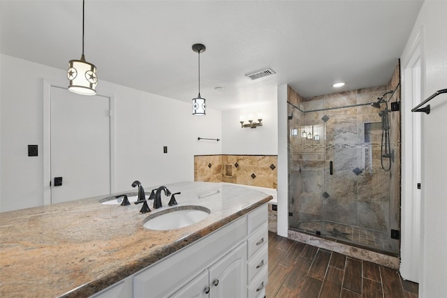 8104 Lea Shore St, Fort Worth, TX 76179 - full bathroom with vanity, a shower stall, wood finished floors, and visible vents
