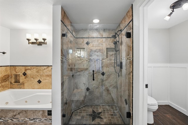 8104 Lea Shore St, Fort Worth, TX 76179 - bathroom with toilet, a wainscoted wall, a whirlpool tub, a shower stall, and wood finished floors