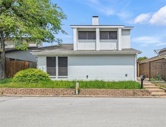 8104 Lea Shore St, Fort Worth, TX 76179 - view of home's exterior featuring fence, a chimney, and brick siding