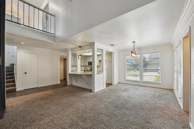 8104 Lea Shore St, Fort Worth, TX 76179 - unfurnished living room with a sink, a chandelier, carpet, baseboards, and stairway