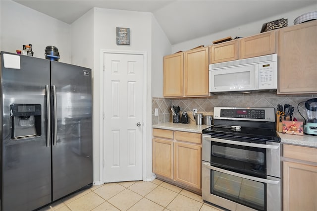 kitchen featuring light brown cabinets, backsplash, appliances with stainless steel finishes, and light countertops