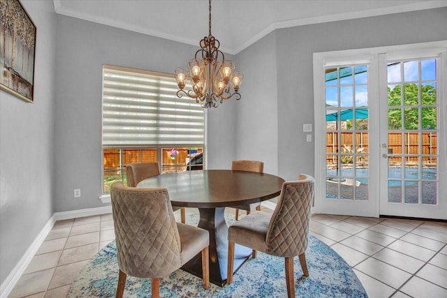 dining area featuring baseboards, a chandelier, light tile patterned floors, and crown molding