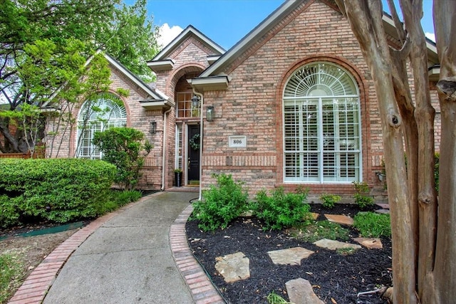 view of front of home featuring brick siding