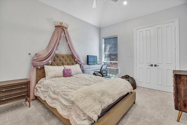 carpeted bedroom featuring a ceiling fan and a closet