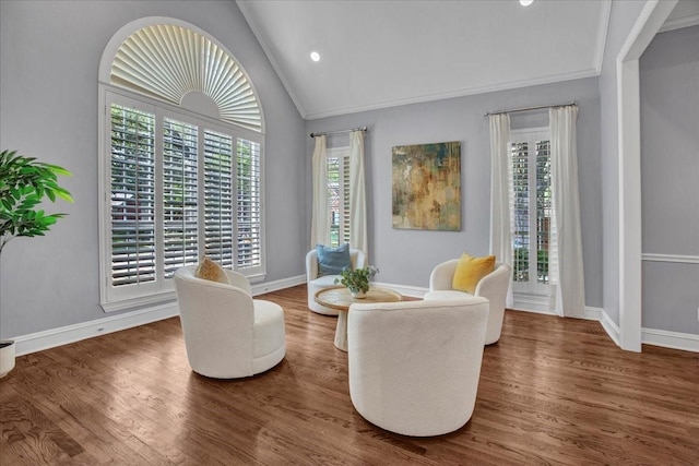 sitting room with recessed lighting, vaulted ceiling, baseboards, and wood finished floors