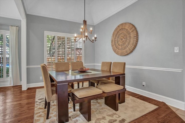 dining room featuring baseboards, wood finished floors, and plenty of natural light