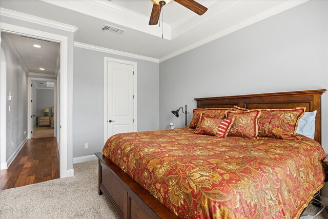 bedroom featuring crown molding, ceiling fan, baseboards, carpet flooring, and visible vents