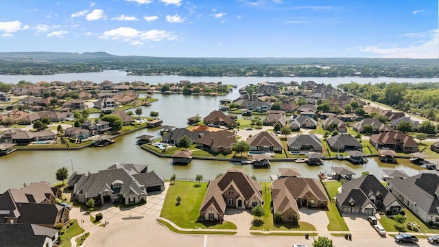 aerial view with a residential view and a water view