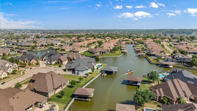 birds eye view of property with a residential view and a water view