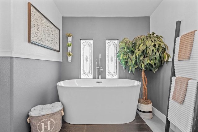 bathroom featuring a freestanding bath