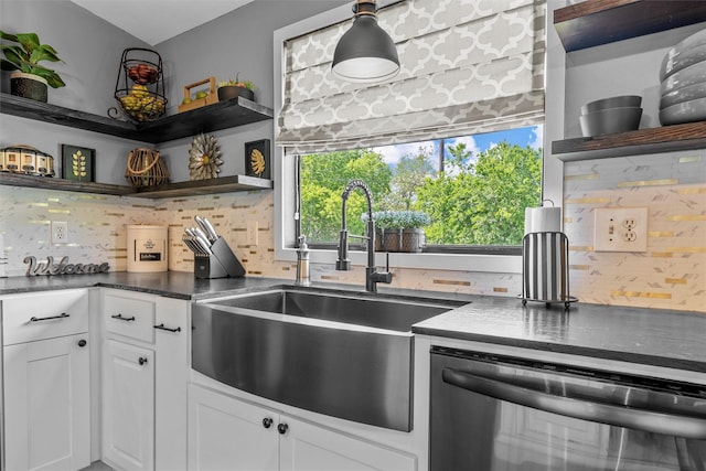 kitchen with open shelves, tasteful backsplash, stainless steel dishwasher, and a sink