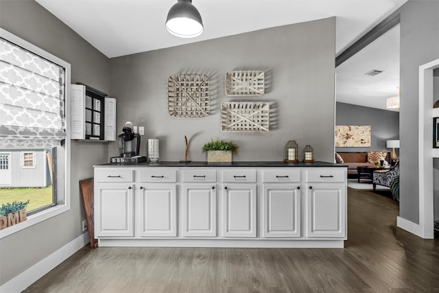 bar with cooling unit, indoor bar, baseboards, dark wood-type flooring, and visible vents