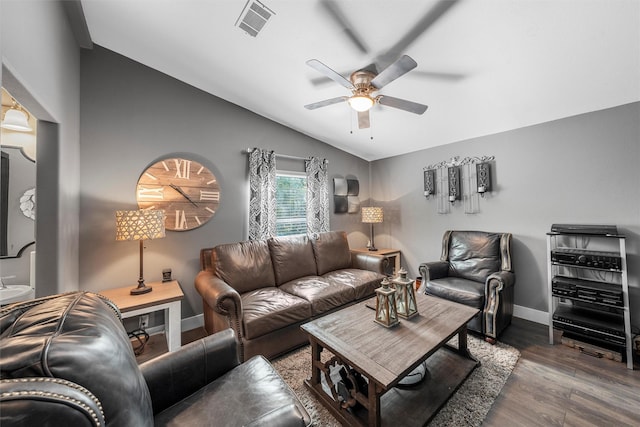 living room featuring lofted ceiling, wood finished floors, visible vents, a ceiling fan, and baseboards
