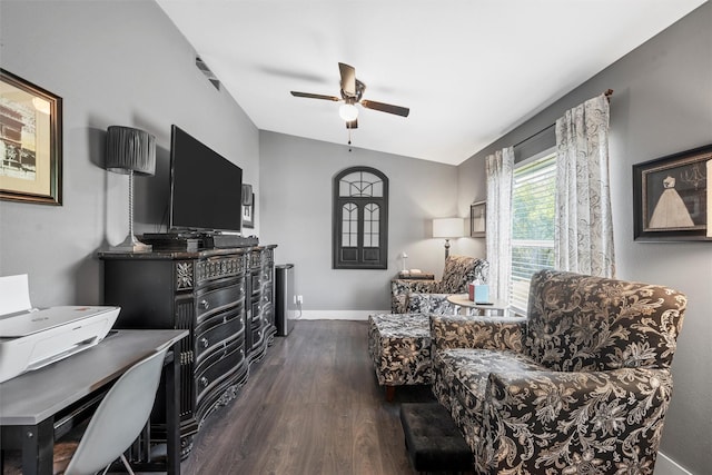 sitting room with lofted ceiling, baseboards, ceiling fan, and dark wood-style flooring