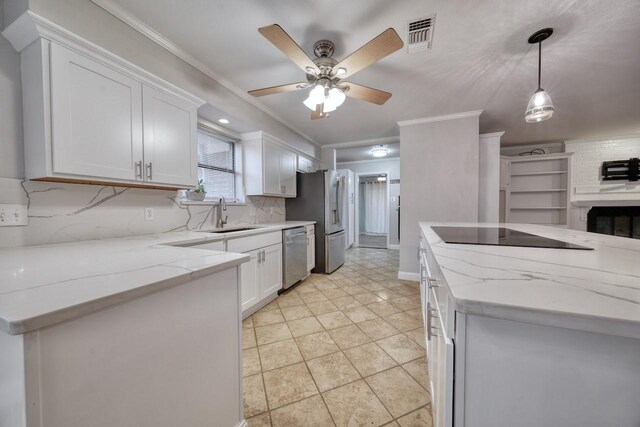1208 Lake Cross Rd, Hideaway, TX 75771 - kitchen with ornamental molding, appliances with stainless steel finishes, a sink, and white cabinetry