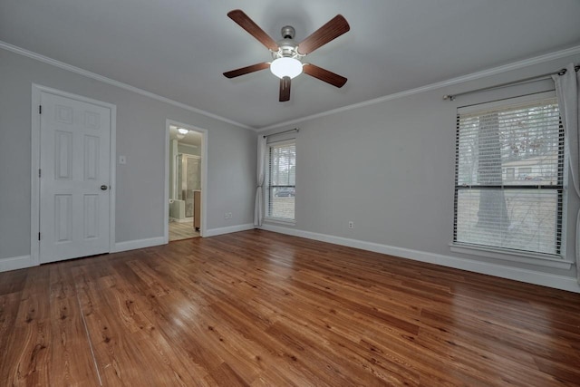 1208 Lake Cross Rd, Hideaway, TX 75771 - unfurnished room featuring baseboards, wood finished floors, ceiling fan, and crown molding