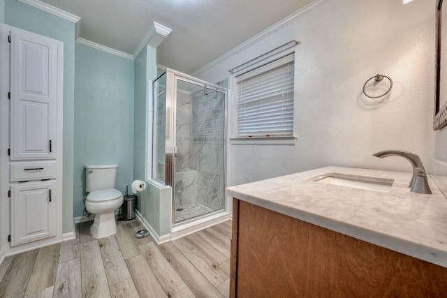 1208 Lake Cross Rd, Hideaway, TX 75771 - bathroom with wood finished floors, toilet, vanity, crown molding, and a stall shower