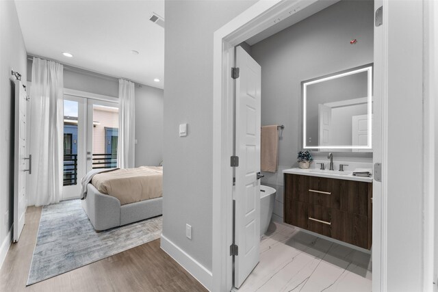 bedroom featuring recessed lighting, baseboards, and wood finished floors