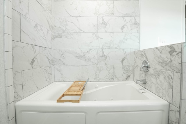 full bath with a whirlpool tub