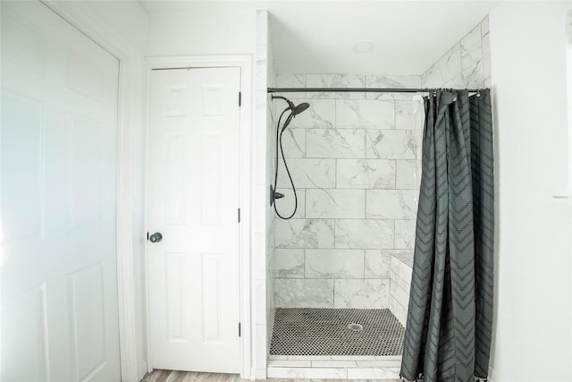 bathroom with a shower stall