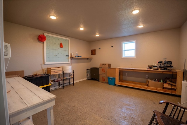 interior space featuring baseboards and recessed lighting