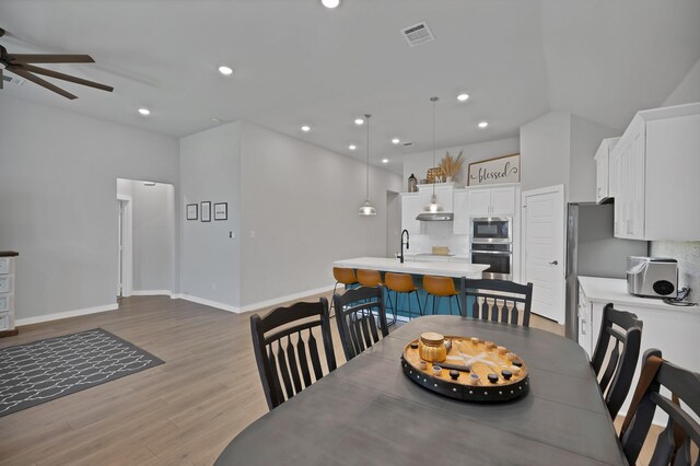 dining room featuring wood finished floors, visible vents, recessed lighting, and ceiling fan