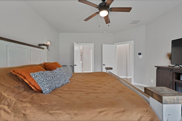 bedroom featuring visible vents, a ceiling fan, and baseboards