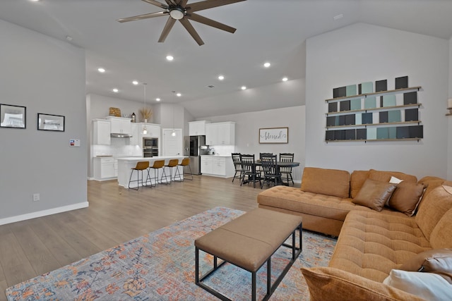 1373 Silverthorn Trl, Justin, TX 76247 - living room featuring a ceiling fan, light wood finished floors, recessed lighting, high vaulted ceiling, and baseboards