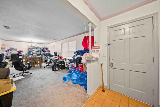 entrance foyer featuring an inviting chandelier, visible vents, baseboards, ornamental molding, and a textured ceiling