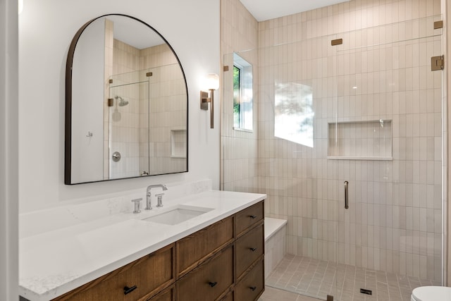 bathroom featuring vanity and a stall shower
