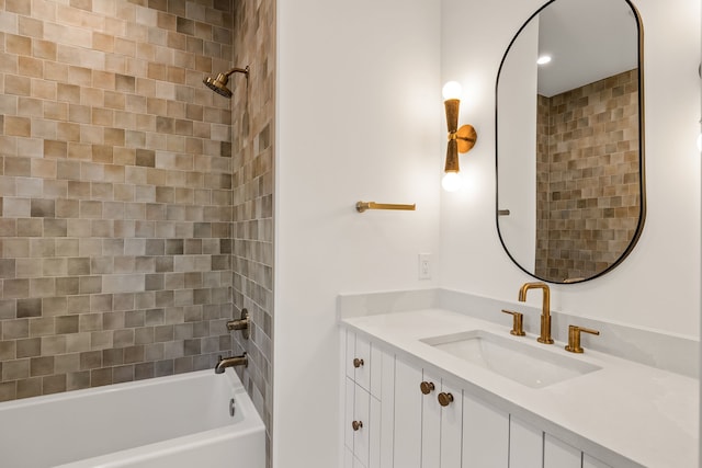 bathroom featuring vanity and  shower combination