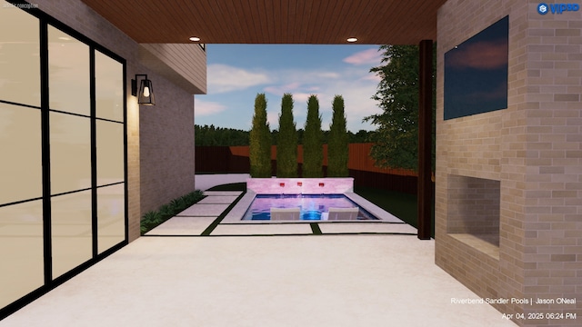 view of swimming pool with fence, a patio, and an in ground hot tub