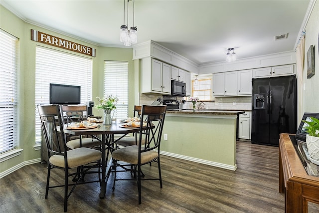 511 Kamber Ln, Wylie, TX 75098 - dining room featuring dark wood finished floors, ornamental molding, and baseboards
