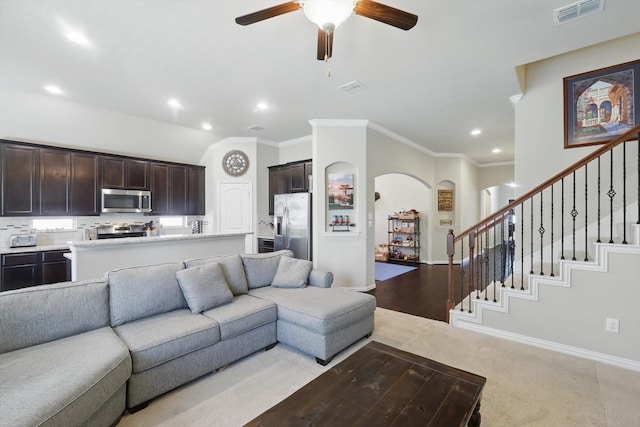 1325 Zanna Grace Way, Fort Worth, TX 76052 - living room with arched walkways, a ceiling fan, recessed lighting, crown molding, and stairway