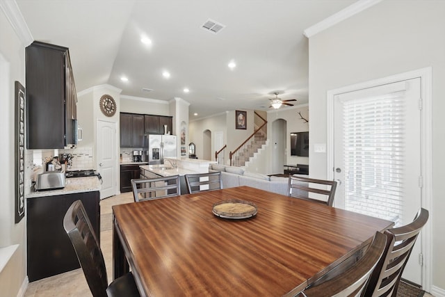 1325 Zanna Grace Way, Fort Worth, TX 76052 - dining area featuring arched walkways, stairway, ornamental molding, ceiling fan, and recessed lighting