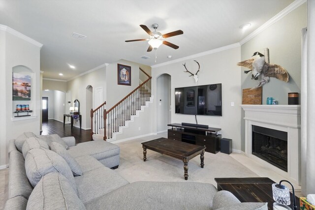 1325 Zanna Grace Way, Fort Worth, TX 76052 - living room with arched walkways, ceiling fan, ornamental molding, stairway, and a fireplace