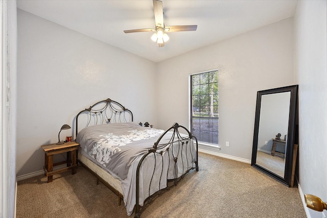 carpeted bedroom with baseboards and ceiling fan