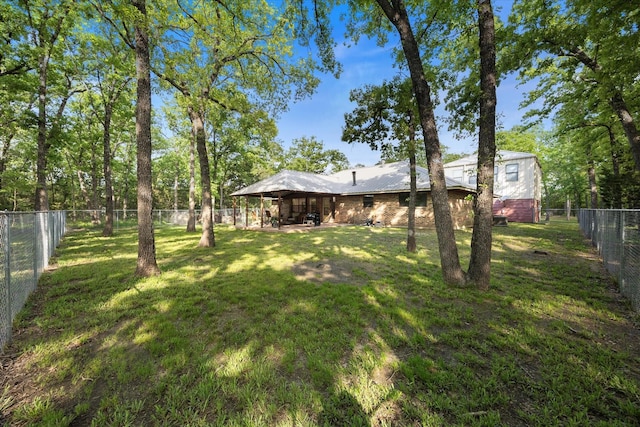 view of yard with a patio area and a fenced backyard