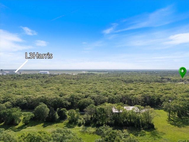 aerial view with a wooded view