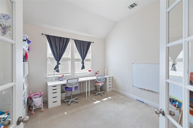 office area with light carpet, vaulted ceiling, visible vents, and baseboards