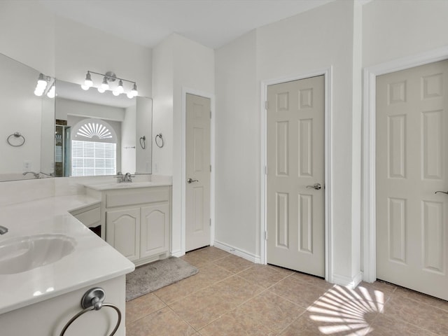 1803 Timber Ridge Dr, Frisco, TX 75036 - bathroom featuring tile patterned floors, double vanity, and a shower