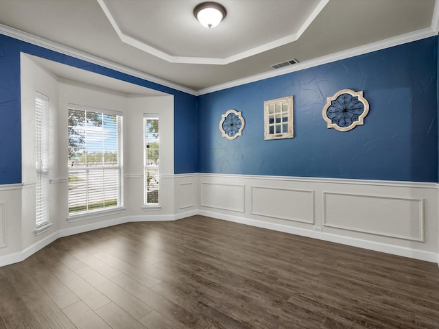 1803 Timber Ridge Dr, Frisco, TX 75036 - empty room with a raised ceiling, a wainscoted wall, and dark wood finished floors