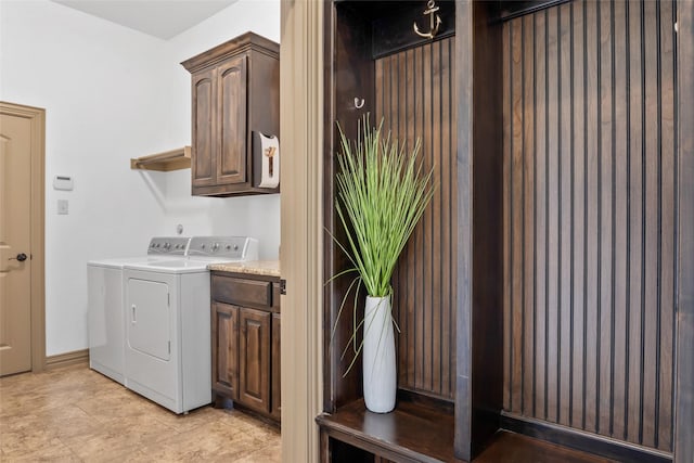 laundry area featuring washer and dryer and cabinet space