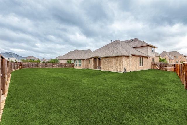 4011 Hollywood Park Ct, Celina, TX 75009 - back of house featuring brick siding and roof with shingles