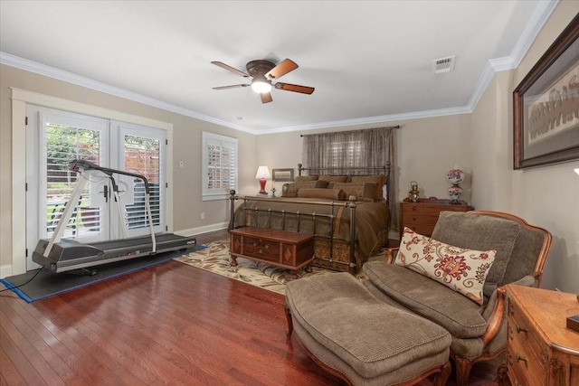 bedroom with access to exterior, wood finished floors, crown molding, baseboards, and french doors