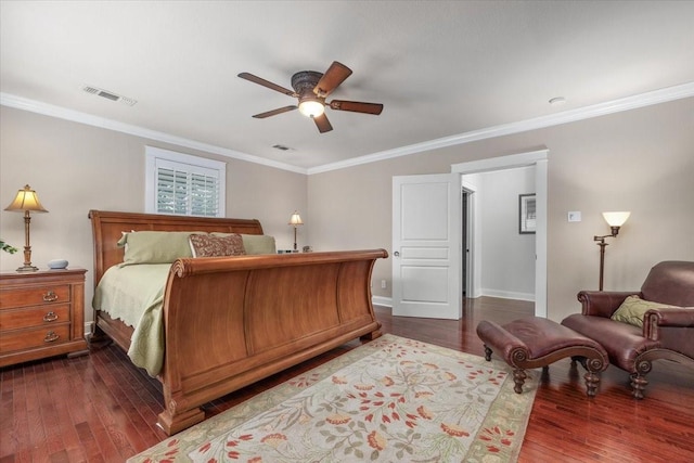 bedroom featuring dark wood-style floors, crown molding, baseboards, and ceiling fan