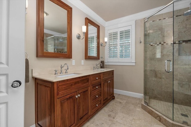 bathroom featuring a stall shower, ornamental molding, baseboards, and double vanity