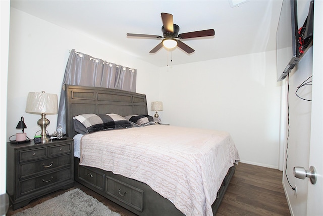 710 Longbeach Dr, Garland, TX 75043 - bedroom featuring a ceiling fan, baseboards, and dark wood finished floors